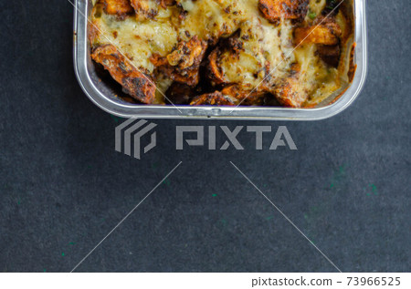 Fried potato fries coated topped with mature cheddar and Monterey Jack cheeses, jalapeno and bacon sauce, finished with mozzarella and parsley Fried potato fries coated topped with mature cheddar and Monterey Jack cheeses, jalapeno and bacon sauce, finished with mozzarella and parsley 73966525