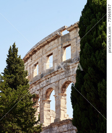 Picturesque ancient Roman amphitheater arena ruins view 73966957