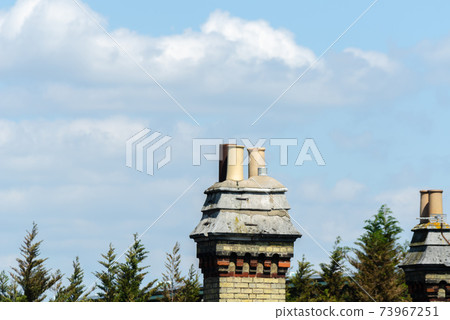 Typical English chimneys on the roofs of London buildings 73967251