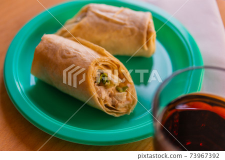 Chicken breast with caesar dressing and lettuce in a gluten-free tortilla wrap 73967392