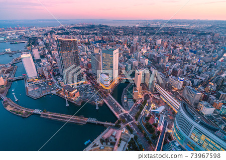Yokohama cityscape of Japan Overlooking the cityscape of Yokohama (sunset). The piers of the ropeway have appeared Yokohama cityscape of Japan Overlooking the cityscape of Yokohama (sunset). The piers of the ropeway have appeared 73967598