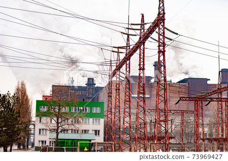 electrical substation for the power supply of the metallurgical plant. smoking chimneys.  73969427