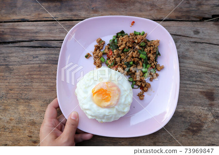 stir fried pork with holy basil and cow pea, fried egg stir fried pork with holy basil and cow pea, fried egg 73969847