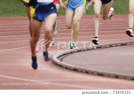 Image photo of the feet of athletes running in athletics stadium Image photo of the feet of athletes running in athletics stadium 73970191