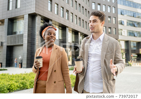 Young couple walking in the city Young couple walking in the city 73972017