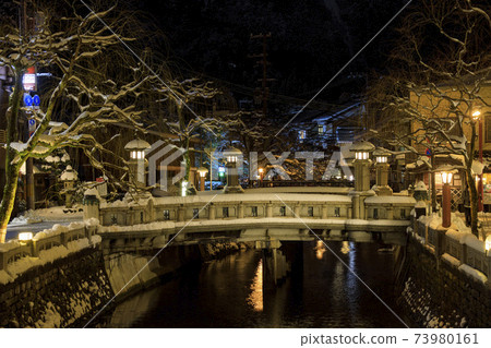 Kinosaki Onsen night view snow scene Kinosaki Onsen night view snow scene 73980161