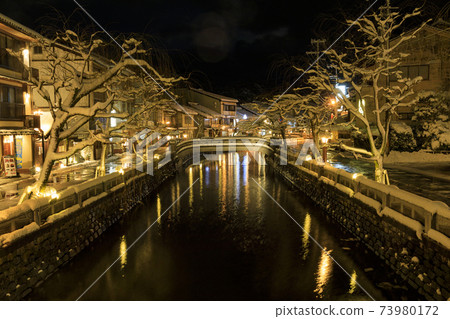 Kinosaki Onsen night view snow scene 73980172