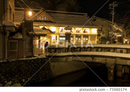 Kinosaki Onsen night view snow scene 73980174