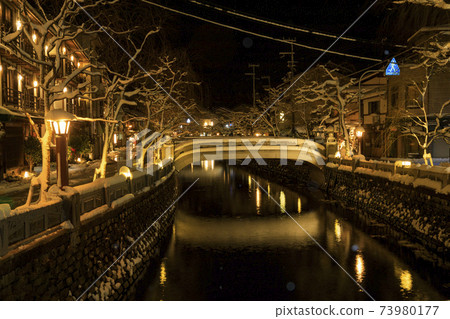 Kinosaki Onsen night view snow scene 73980177