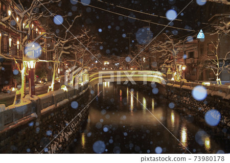 Kinosaki Onsen night view snow scene Kinosaki Onsen night view snow scene 73980178