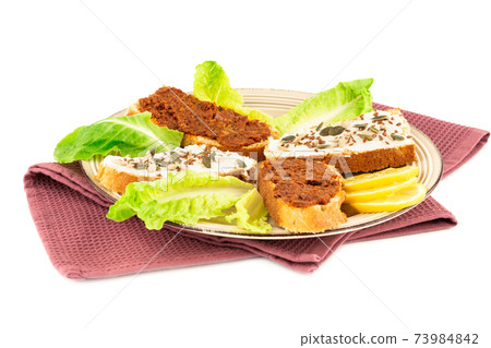 Sandwiches on beige plate Sandwiches on beige plate 73984842