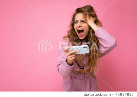 Photo of attractive crazy amazed surprised young woman wearing casual stylish clothes standing 73984935