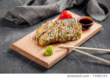 Tempura sushi rolls with cheese and crab meat 73985154