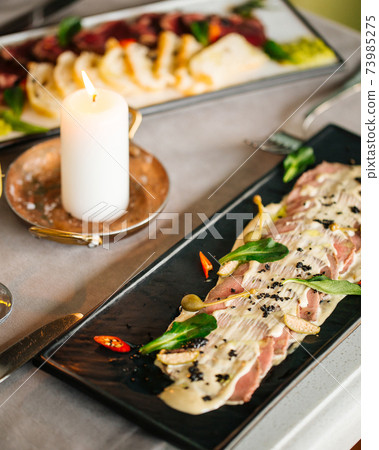 Appetizer vitello tonnato with beef and sauce Appetizer vitello tonnato with beef and sauce 73985275