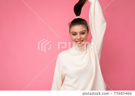 Photo of cute nice charming gorgeous pretty youngster smiling toothily in stylish white sweater 73985466