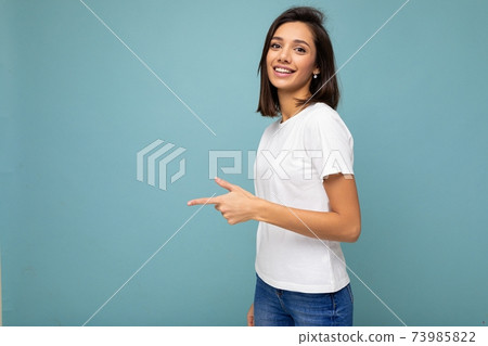 Photo of young positive happy smiling beautiful woman with sincere emotions wearing stylish clothes 73985822