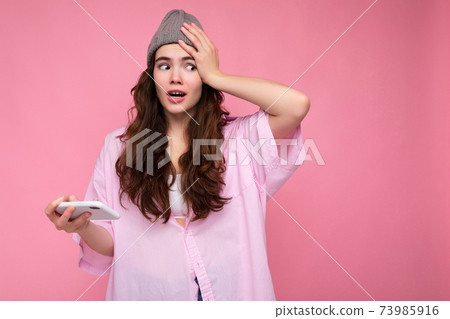 Photo of attractive crazy amazed surprised young woman wearing casual stylish clothes standing Photo of attractive crazy amazed surprised young woman wearing casual stylish clothes standing 73985916