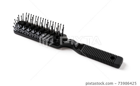 New black hair brush with handle isolated on white background. Combing and hair care. 73986425