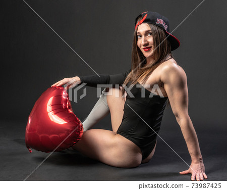 fitness woman gym black. In a black bathing suit. , human leg adult. figure, torso Caucasian ethnicity. Happy Valentines Day fitness woman gym black. In a black bathing suit. , human leg adult. figure, torso Caucasian ethnicity. Happy Valentines Day 73987425