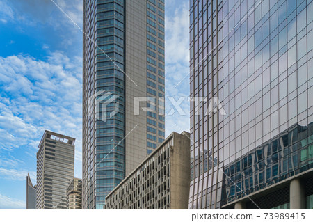 Skyscraper and office building in business financial district 73989415