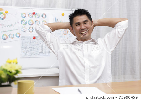 Asian businessman sitting at home office look at camera doing online work interview during vide conference chat. Webcam view. Business people smiling using video call contact with friend, customers, 73990459