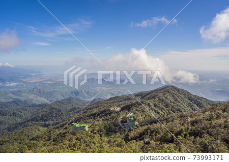 Cable car to famous tourist attraction - European city at the top of the Ba Na Hills, Vietnam Cable car to famous tourist attraction - European city at the top of the Ba Na Hills, Vietnam 73993171