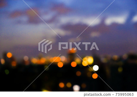 Blurred colorful sunset sky cloud with city building 73995063