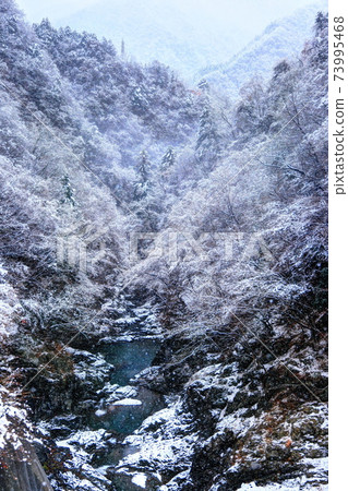 Snow scene of Tamagawa River just below Ogouchi Dam Snow scene of Tamagawa River just below Ogouchi Dam 73995468