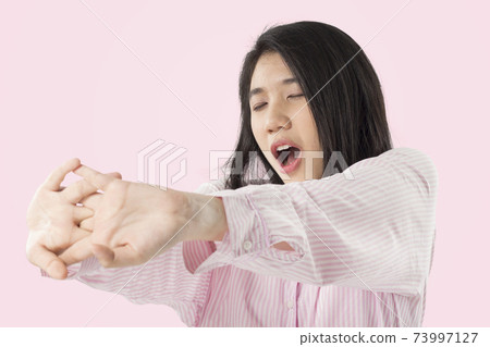 young asian woman feeling sleepy young asian woman feeling sleepy 73997127