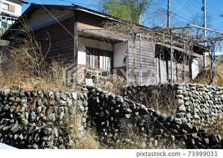 A house built on a stone wall A house built on a stone wall 73999031