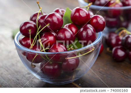 Freshly harvested cherries in a bowl from your home garden. 74000160