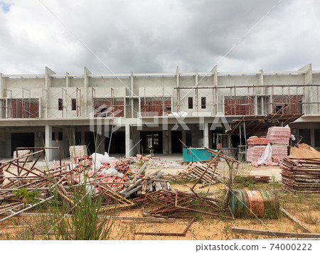SEREMBAN, MALAYSIA -APRIL 09, 2020: New double story luxury terrace house under construction in Malaysia. Designed by an architect with a modern and contemporary style. SEREMBAN, MALAYSIA -APRIL 09, 2020: New double story luxury terrace house under construction in Malaysia. Designed by an architect with a modern and contemporary style. 74000222