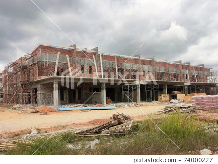 SEREMBAN, MALAYSIA -APRIL 09, 2020: New double story luxury terrace house under construction in Malaysia.  Designed by an architect with a modern and contemporary style.  74000227