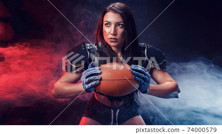Sportive woman with rugby ball Sportive woman with rugby ball 74000579