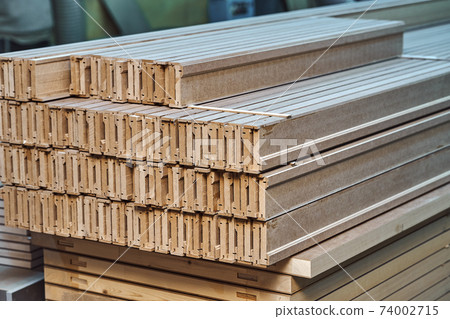 Joinery. Wood door manufacturing process. Stacked door architraves. Furniture manufacture 74002715