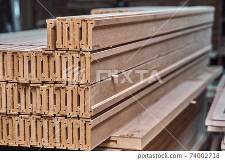 Joinery. Wood door manufacturing process. Stacked door architraves. Furniture manufacture 74002718
