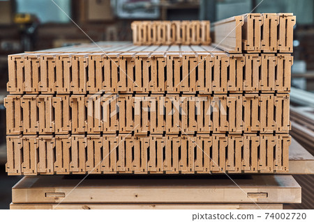 Joinery. Wood door manufacturing process. Stacked door architraves. Furniture manufacture 74002720