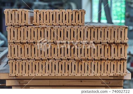 Joinery. Wood door manufacturing process. Stacked door architraves. Furniture manufacture Joinery. Wood door manufacturing process. Stacked door architraves. Furniture manufacture 74002722