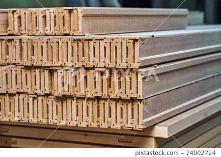 Joinery. Wood door manufacturing process. Stacked door architraves. Furniture manufacture 74002724