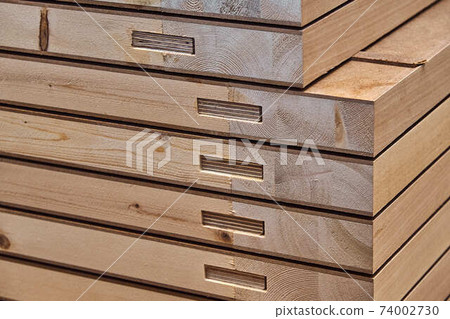 Joinery. Wood door manufacturing process. Stacked door leafs. Furniture manufacture 74002730