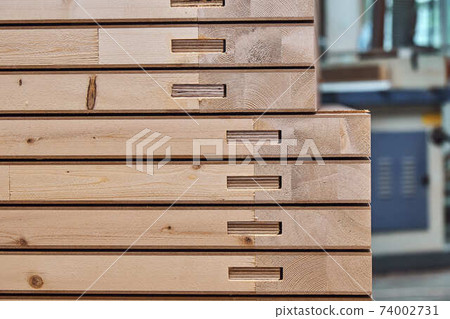 Joinery. Wood door manufacturing process. Stacked door leafs. Furniture manufacture 74002731