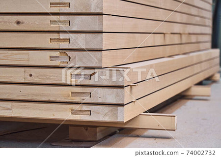 Joinery. Wood door manufacturing process. Stacked door leafs. Furniture manufacture 74002732