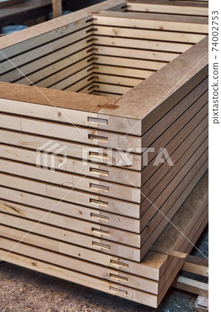 Joinery. Wood door manufacturing process. Stacked door leafs. Furniture manufacture Joinery. Wood door manufacturing process. Stacked door leafs. Furniture manufacture 74002753