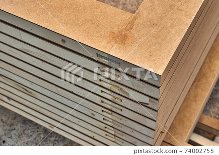 Joinery. Wood door manufacturing process. Stacked door leafs. Furniture manufacture 74002758