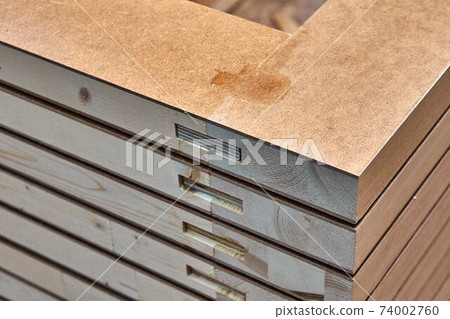 Joinery. Wood door manufacturing process. Stacked door leafs. Furniture manufacture Joinery. Wood door manufacturing process. Stacked door leafs. Furniture manufacture 74002760