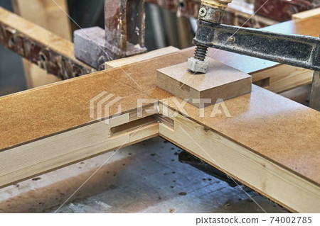 Joinery. Wood door manufacturing process. Clamping and gluing door leaf. Furniture manufacture 74002785