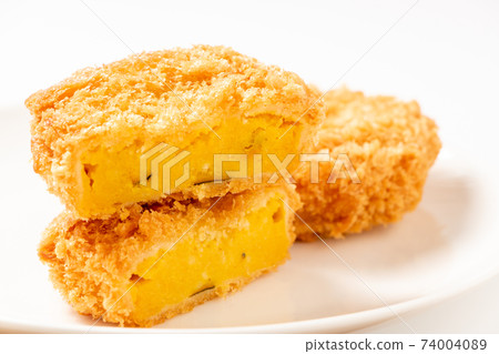 Cross section of pumpkin croquette. Cross section of pumpkin croquette. 74004089