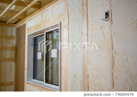 Construction site of a newly built single-family house with spray insulation 74004476