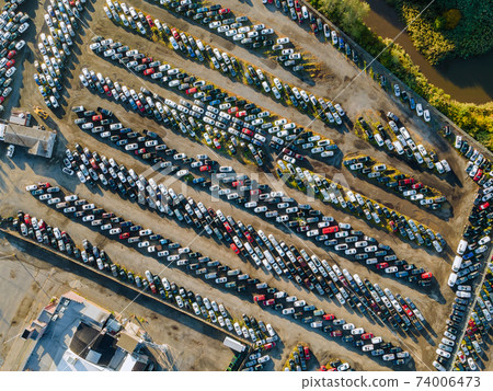 Aerial top view of used car auction for sale a parking lot Aerial top view of used car auction for sale a parking lot 74006473