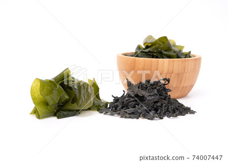 Dried and fresh seaweed wakame isolated on white background. Japanese food Dried and fresh seaweed wakame isolated on white background. Japanese food 74007447